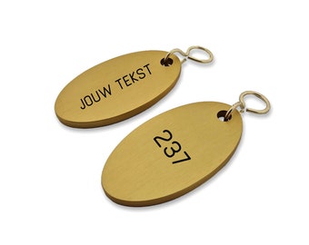 Cantal hotel key ring with black engraving, golden key ring with room number and hotel name, engraved key ring for hotels