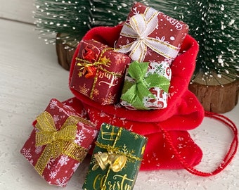 May include: A red velvet Santa sack filled with five wrapped Christmas gifts. The gifts are decorated with snowflakes, bows, and the words "Merry Christmas".