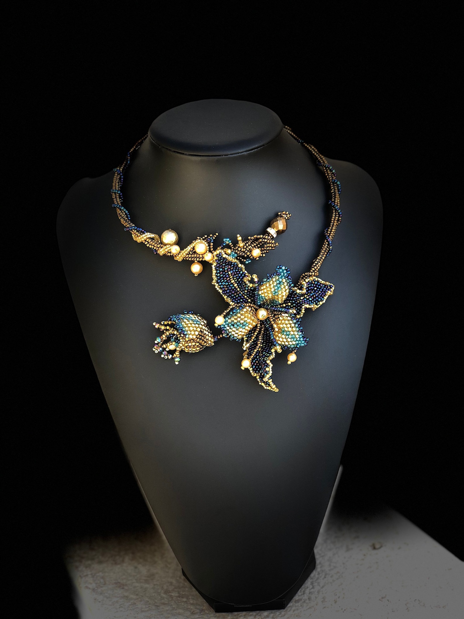 Blue beaded choker with gold centerpiece