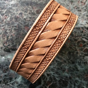 Leather bracelet with  Celtic knot and ribbon pattern