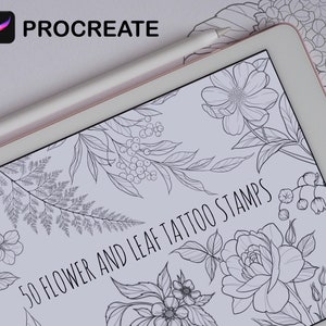 May include: A digital tablet displaying a Procreate design of 50 flower and leaf tattoo stamps. The design is in black and white and features various floral and leaf motifs.
