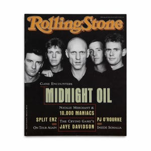 May include: Rolling Stone magazine cover featuring the band Midnight Oil. The cover has a black background with the band members' faces. Text includes "Close Encounters," "Natalie Merchant & 10,000 Maniacs," and "The Crying Game's Jaye Davidson."