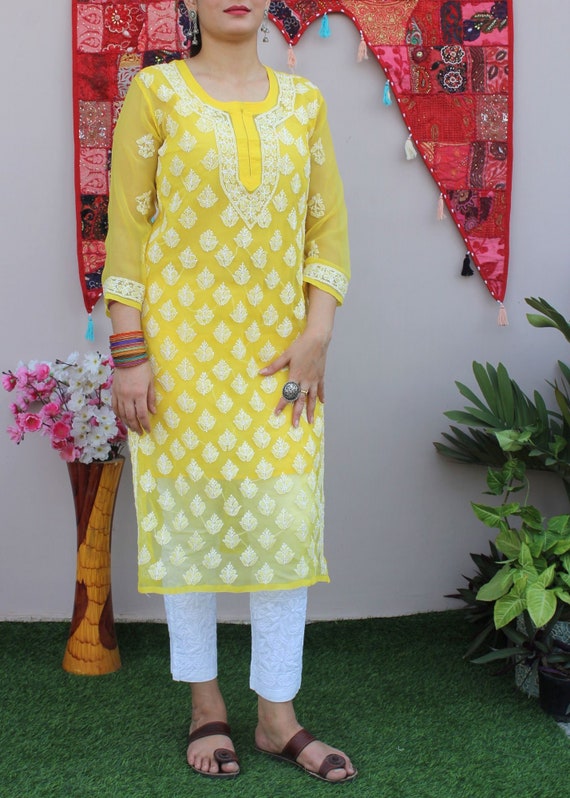 Rajool's yellow colored kurti with matching York pattern and designer  sleeves and white matching lace, along