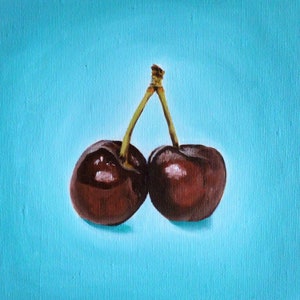 May include: A painting of two ripe cherries with a shared stem against a light blue background. The cherries are a deep red-brown color with glossy highlights, suggesting freshness. The stem is a light green-brown, contrasting with the fruit and background.