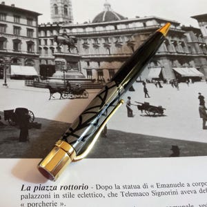 REDÓ FLORENCE 1989 - Ballpoint pen "Ebenum Carving", precious resin with 24Kt gold plated bronze elements and enamels.Made in Florence-Italy