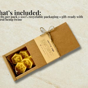 May include: A rectangular brown cardboard box containing yellow honeycomb-shaped wax melts. The packaging features a label reading vanilla sage and is tied with natural hemp twine. Text states: what's included: 8 melts per pack, 100% recyclable packaging, gift-ready with natural hemp twine.