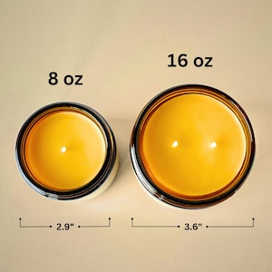 This image shows the different candle sizes and dimensions. the 8 oz candle diameter is 2.9 inches and the 16 oz candle diameter is 3.6 inches.