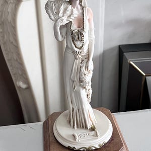 A Belcari Figurine - Etsy