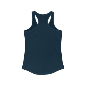 May include: A navy blue racerback tank top. The tank top has a scoop neck and a racerback design. The fabric appears to be a soft, lightweight material. The tank top is a solid color and has a curved hemline.