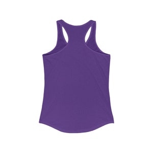 May include: A solid purple racerback tank top. The tank top has a scoop neck and a curved hemline. The back features a racerback design with thin straps. The fabric appears to be a soft, lightweight material, suitable for casual wear.