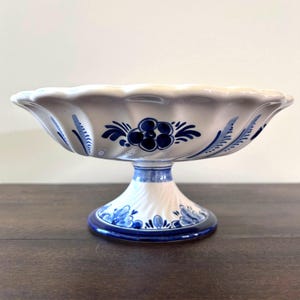 May include: A rustic wooden sign with the text "Welcome to our home" in a handwritten style. The sign features a distressed finish and a simple, inviting design, perfect for a front porch or entryway.