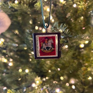 Repurposed Vintage 15 cent Christmas Stamp Ornament in Brass Glass Locket