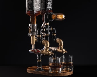 May include: A black and gold metal liquor dispenser with three bottles, two glasses, and a light bulb. The dispenser is made of pipes and fittings and has a rustic design.