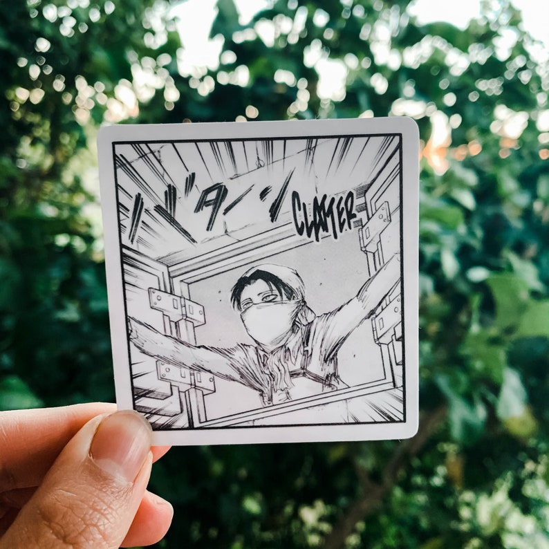 May include: Square sticker featuring a black and white manga panel. The panel depicts a character with a face covering, arms outstretched, and the word "CLATTER" in bold text. The background is a blurred green.