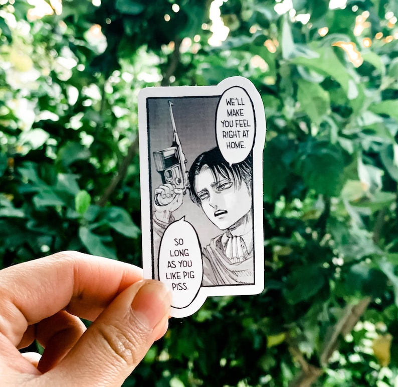 May include: A rectangular sticker featuring a black and white manga panel. The panel depicts a character holding a gun with speech bubbles that read, "We'll make you feel right at home" and "So long as you like pig piss."