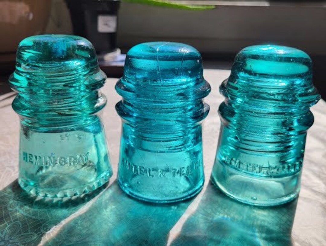 Set of 3 Aqua Glass Insulators. 2 Am. Tel. & Tel. Co., 1 Hemingray No