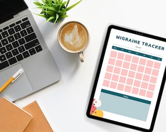 May include: A digital tablet displaying a migraine tracker with a calendar grid and a notes section. The tablet is on a white surface with a laptop, a cup of coffee, and a potted plant.