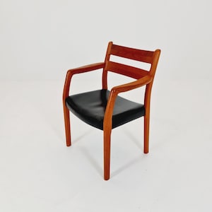 Mid century Danish teak armchair by EMC Mobler from the 60s