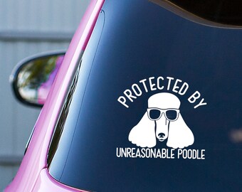 May include: White vinyl sticker with a white poodle wearing sunglasses and the text "Protected by Unreasonable Poodle".