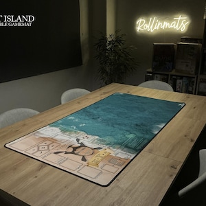 May include: A rectangular Spirit Island compatible game mat with a detailed map design. The mat features a turquoise ocean scene and a tan land area with game elements. The mat is placed on a wooden table, ready for gameplay.