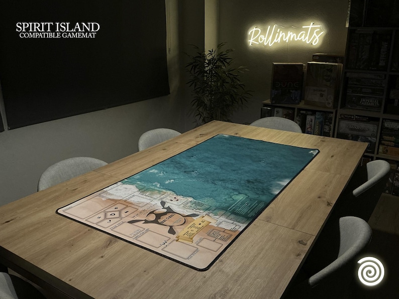 May include: A rectangular Spirit Island compatible game mat with a detailed map design. The mat features a turquoise ocean scene and a tan land area with game elements. The mat is placed on a wooden table, ready for gameplay.