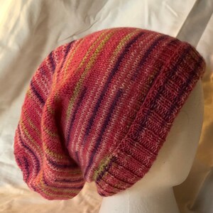 Hand Knit  Slouch hat, Pinks, Purple and hint of Green, Cozy and super soft!  Soft wool and nylon blend.