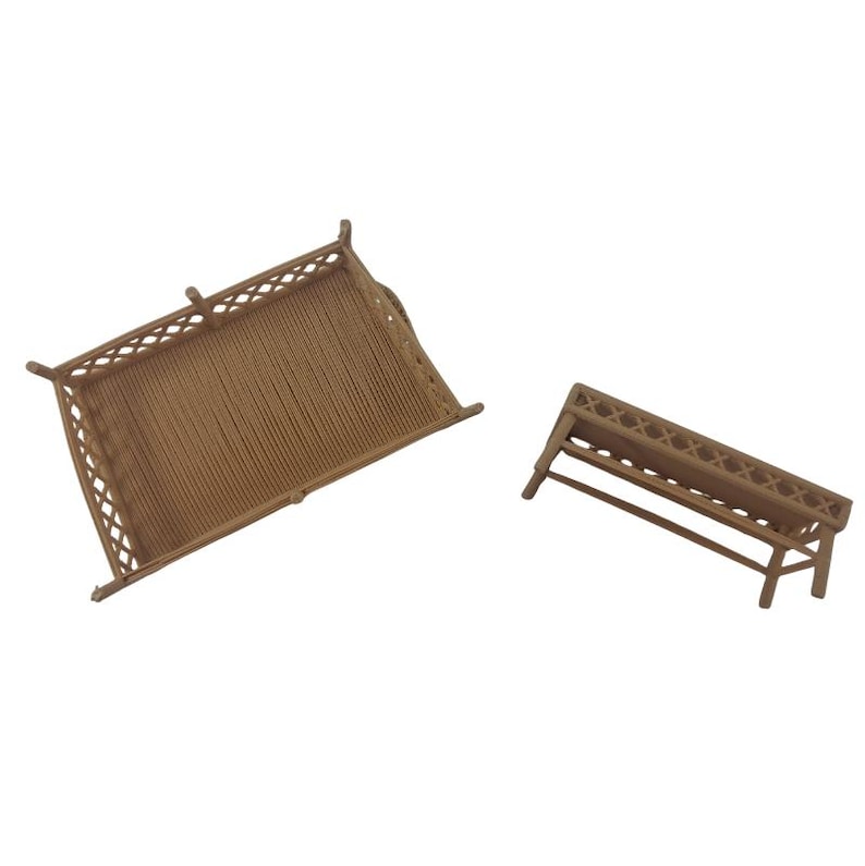 May include: Two miniature brown furniture pieces, including a rectangular bed frame with a lattice-style headboard and footboard, and a smaller rectangular bench or table featuring a matching lattice design on the side panels.