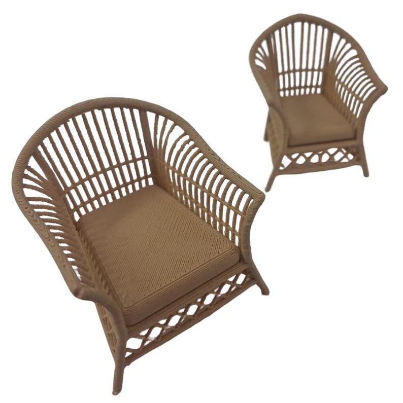 May include: Two miniature armchairs featuring a light brown, woven-style texture. Each chair has a high, rounded backrest with vertical slats, a flat seat, and a decorative lattice pattern along the base, all rendered in a uniform light brown color.