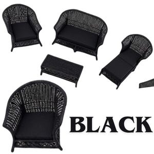 May include: A miniature furniture set in black, featuring a sofa, two armchairs, a chaise lounge, and a rectangular coffee table. Each piece has a woven frame and solid black cushions. The word BLACK is printed in large, bold, black capital letters.