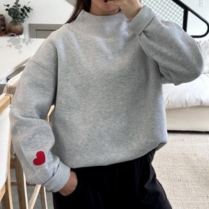 Heart On My Sleeve Mock Neck Sweatshirt