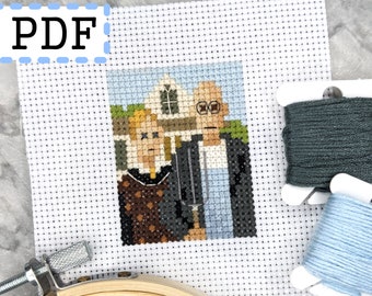 May include: A cross-stitch pattern of American Gothic, featuring a man and woman standing in front of a house. The pattern is printed on white Aida cloth and comes with floss in blue and gray.