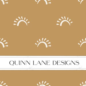 May include: A seamless pattern featuring white stylized sun illustrations on a brown background. The text "QUINN LANE DESIGNS" is centered at the bottom of the image.