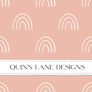 May include: A seamless pattern featuring white rainbow arches on a light pink background. The text "QUINN LANE DESIGNS" is centered at the bottom of the image.