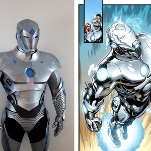 May include: A silver and blue Iron Man costume, featuring a helmet, chest plate, and articulated limbs. The costume has blue accents and a sleek, metallic finish. A comic book panel shows a similar Iron Man figure in flight.