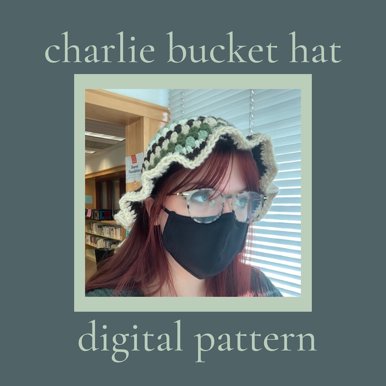 May include: A crochet bucket hat with a green, brown, and white color pattern. The hat has a ruffled brim and is worn by a person with red hair and glasses.