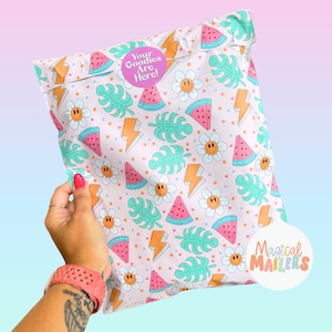 May include: A pink and white poly mailer with a watermelon, lightning bolt, and flower pattern. The mailer has a sticker that says "Your Goodies Are Here!" and a logo that says "Magical Mailers".