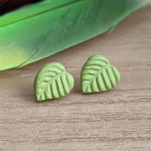 Tiny green leaf, polymer clay studs. Floral earrings. Plant mom jewelry gifts for women under 10. Wide jungle leaf, nature inspired studs.
