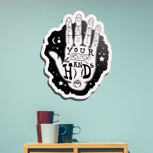 May include: A set of three ceramic mugs with a speckled, matte finish. The mugs are in shades of cream, light gray, and dark gray. Each mug has a simple, minimalist design and a rounded handle.