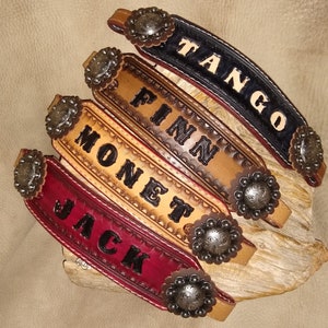 May include: Five leather wristbands with decorative metal accents and personalized names: Jack, Monet, Finn, Tango, and Jack.
