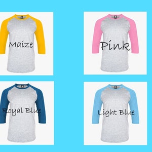 May include: Four baseball t-shirts with different colored sleeves. The shirts are grey with maize, pink, royal blue, and light blue sleeves. The text on the shirts reads "Maize", "Pink", "Royal Blue", and "Light Blue".