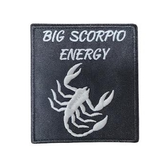 May include: Black embroidered patch with a white scorpion and the text "BIG SCORPIO ENERGY".