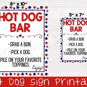 May include: Printable sign for a hot dog bar with red, white and blue stars. The sign says "Hot Dog Bar" and includes instructions: "Grab a bun, pick a dog, pile on your favourite toppings. Enjoy!"