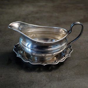 Antique silver plated gravy boat & tray. Made in England