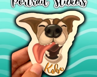 May include: A custom pet portrait sticker featuring a dog with brown and white fur, sticking its tongue out. The dog's name, "Kobe", is written in orange text on the sticker.