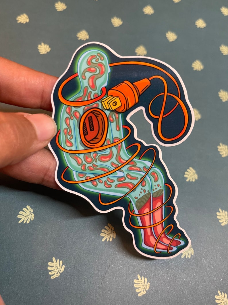 May include: A sticker featuring a stylized illustration of a person with an electrical cord wrapped around them. The cord is plugged into a socket in the person's chest. The person is outlined in green and has red and orange patterns inside. The cord is orange and black.