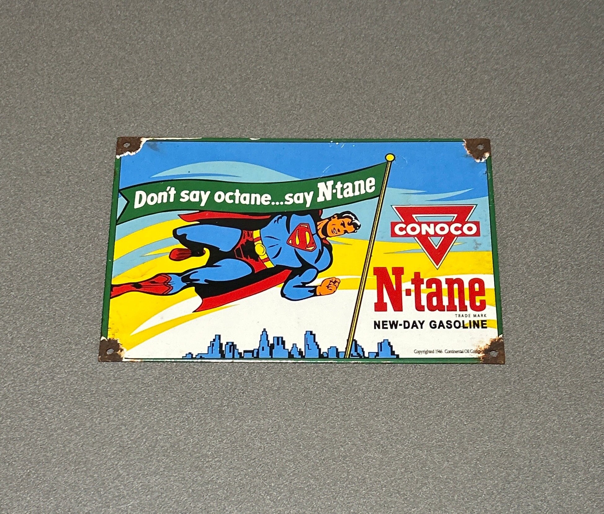 VINTAGE 12” 1946 SUPERMAN CONOCO N-tane Porcelain Sign Gas Oil Car