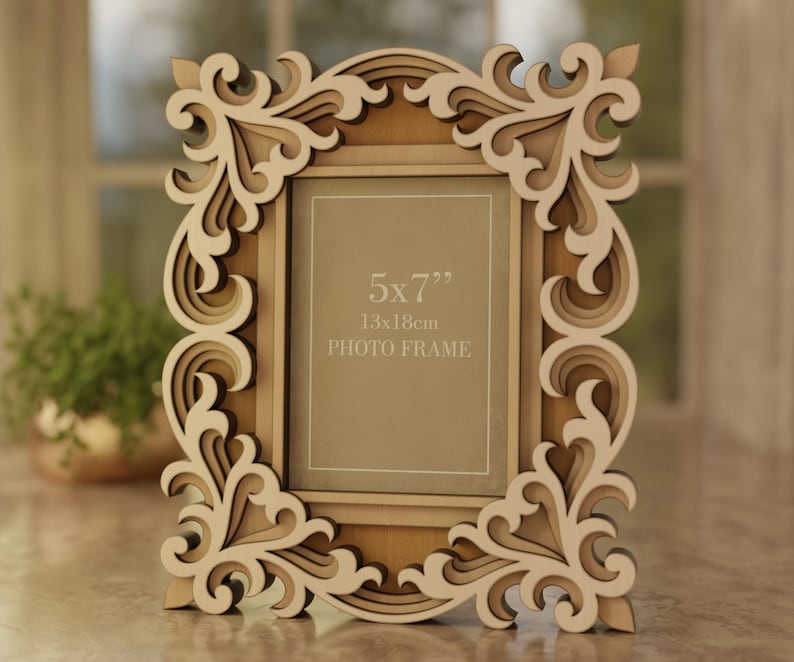May include: A decorative wooden photo frame with an ornate, layered design. The frame is light brown with cream-colored accents and features the text "5x7" 13x18cm PHOTO FRAME". The frame is designed to hold a 5x7 inch photo.