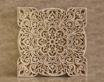 May include: A detailed, intricate, laser-cut wooden mandala design with a brown color. The design features a circular pattern with multiple layers of intricate details.