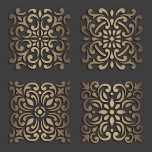 May include: Four gold-colored decorative tiles with intricate floral patterns. The tiles are square and have a raised, embossed design.