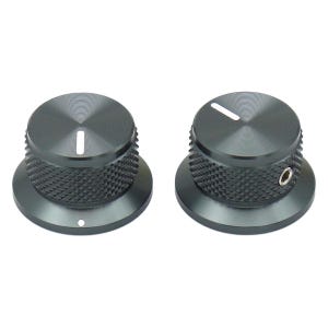 May include: Two dark gray metal control knobs with a circular, knurled grip pattern on the sides. Each knob features a flat top surface with a single white indicator line. The right knob includes a visible silver set screw on the side.